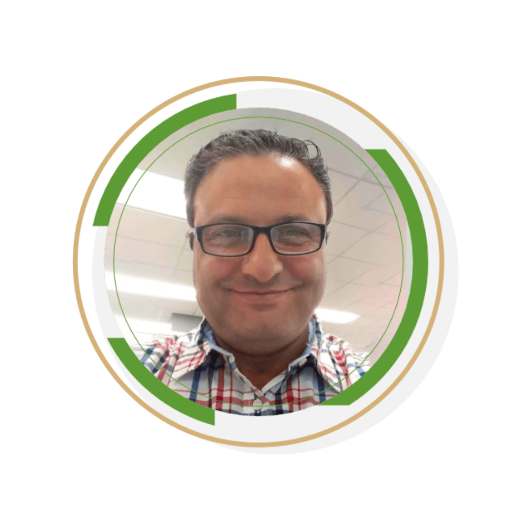 Circular profile picture of a person with glasses and a checkered shirt.